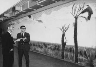 [Taro Yashima in front of Kagoshima Science Museum mural at Natural History Museum of Los Angeles, Los Angeles, California, February 25, 1969]