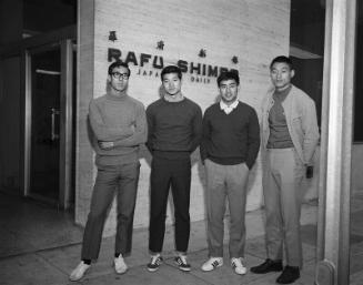 [Four young men in front of Rafu Shimpo building, Los Angeles, California, June 8, 1969]