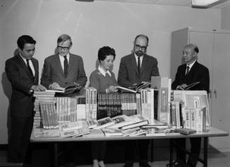 [Vice Consul of Japan, Miyoko Iida, presenting books to UCLA research library, Los Angeles, California, October 20, 1969]