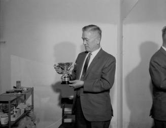 [Mr. Kato holding golf tournament trophy, California, June 1970]