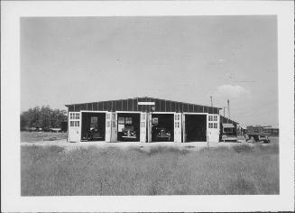 [Automobiles parked in garage, Rohwer, Arkansas, 1942-1945]