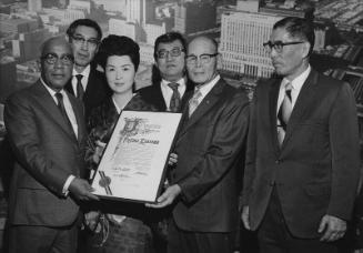 [City Council resolution presentation to Kansuma Fujima by Los Angeles councilman Gilbert W. Lindsay in City Hall, Los Angeles, California, December 22, 1970]