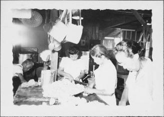 [Three women chopping food in mess hall kitchen, Rohwer, Arkansas, July 30, 1944]