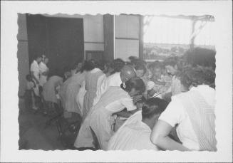 [Candy stripers helping with examination of children, Rohwer, Arkansas, July 6, 1944]