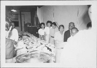 [Men and women standing in line in mess hall, Rohwer, Arkansas, 1942-1945]