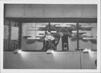 [Young man in court attire with fan and bells in Kabuki play, Rohwer, Arkansas, October 21, 1944]