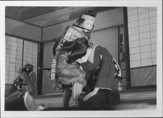 [Warrior looks down at bowing woman in Kabuki play, Rohwer, Arkansas, 1944]