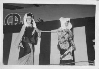 [Traveling blind musician and companion in Kabuki play, Rohwer, Arkansas, November 12, 1944]