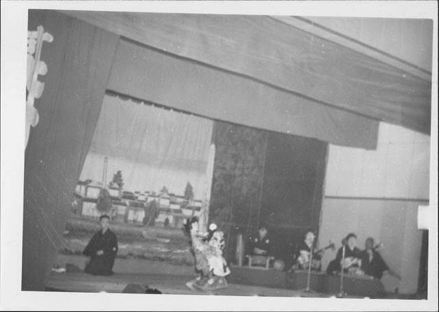 [Woman dancing on stage accompanied by musicians, Rohwer, Arkansas]