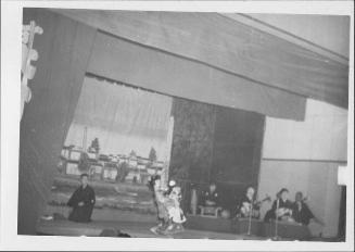[Woman dancing on stage accompanied by musicians, Rohwer, Arkansas]