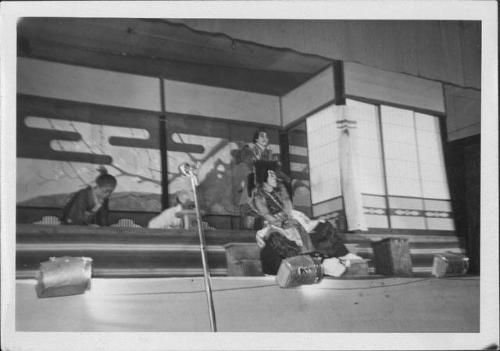 [Two older commoners bow to two warriors in Kabuki play, Rohwer, Arkansas, November 12, 1944]